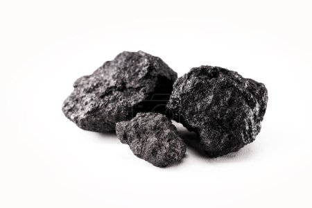 Téléchargez les photos : Petroleum coke, or coke, is a final solid material rich in carbon derived from petroleum refining, used in the manufacture of steel, in the production of pig iron - en image libre de droit