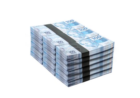 Foto de Wad of money, grand prize, one hundred thousand reais of brazil money, concieot of savings, income, wealth, earnings or lottery, on isolated white background - Imagen libre de derechos