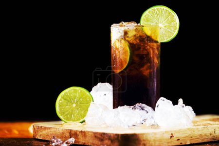 Photo for Rum and Cola Cuba Libre with Lemon and Ice - Royalty Free Image