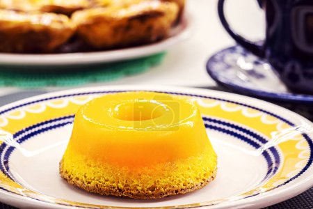 Photo for Dessert made with eggs, called in Brazil as quindim and in Portugal as Brisa de Lis, a tasty yellow sweet - Royalty Free Image