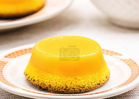 Photo for Quindim or Brisa do Lis, typical sweet from Brazil and Portugal, made with egg yolks, almonds or grated coconut - Royalty Free Image
