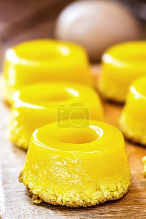 Photo for Typical of northeastern Brazil, called Quindim, its ingredients are egg yolk, sugar and grated coconut. - Royalty Free Image