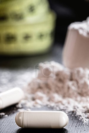 Photo for Sports supplement, creatine, hmb, bcaa, amino acid or powdered vitamin. Sports nutrition concept. bcaa, l-carnitine, creatine - Royalty Free Image