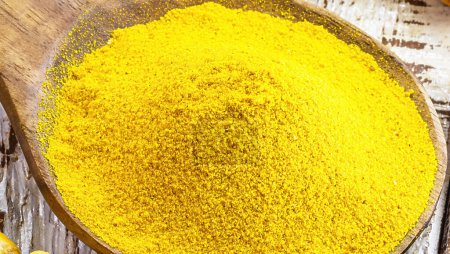 spoon of curry or turmeric powder, macro photography