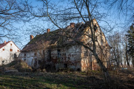 Photo for Krolikowice, Poland - February 9, 2023: Ruined residential house, outbuilding of a XVIII century neo-renaissance palace. German historical architecture in Lower Silesia. - Royalty Free Image