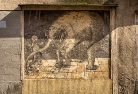 Photo for Trzebiatow, Poland - September 18, 2023: Old sgraffito with elephant on the wall in historical city center. - Royalty Free Image
