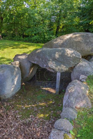 Photo for Frontal view of Dolmen 30e in the vicinity of the shooting range in Dotlingen. The long exposure gives motion blur in the leave - Royalty Free Image