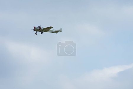 Photo for Editorial: DEURNE, FLANDERS, BELGIUM, MAY 21, 2023 - Low speed pass of a Lockheed Model 10 Electra during an air display at the 100th anniversary of Antwerp Airport - Royalty Free Image
