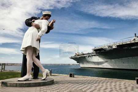 Photo for Capture the spirit of romance and historic nostalgia with this captivating photograph of San Diegos famous Unconditional Surrender statue. Depicting a sailor and a woman locked in a passionate kiss - Royalty Free Image