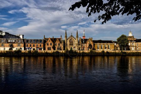 Photo for Journey back in time with this evocative image featuring the historic houses along Ness Walk, situated by the River Ness in Inverness, Scottish Highlands. These stately homes stand as silent witnesses - Royalty Free Image