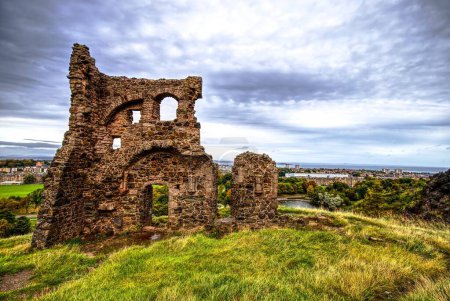 Photo for Venture into the past with this evocative photograph of St. Anthony Chapel, an enduring relic from the early 15th century. Situated in the storied Holyrood Park and formerly held by the Abbeys of - Royalty Free Image