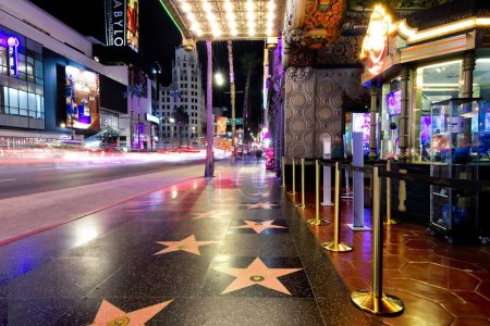 Photo for Stunning photograph capturing the iconic Hollywood Walk of Fame. This famous sidewalk stretches 1.3 miles along Hollywood Boulevard and features more than 2,600 terrazzo and brass stars embedded in - Royalty Free Image