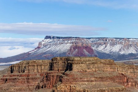 Photo for Experience ethereal beauty with this high-resolution photograph showcasing Grand Canyon West set against a sky gently kissed by clouds. The image captures the canyons rugged red-rock formations - Royalty Free Image
