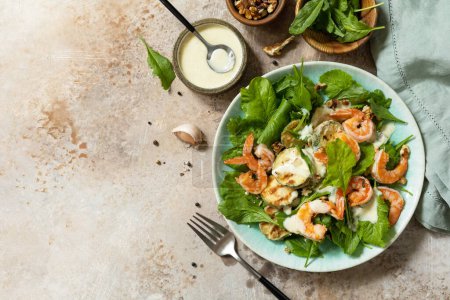 Photo for Healthy food concept. Vegetarian vegetable low carb lunch bowl. Diet salad shrimps with arugula, grilled zucchini and walnut. View from above. Copy space. - Royalty Free Image