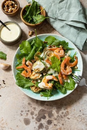 Photo for Healthy food concept. Vegetarian vegetable low carb lunch bowl. Diet salad shrimps with arugula, grilled zucchini and walnut. Copy space. - Royalty Free Image