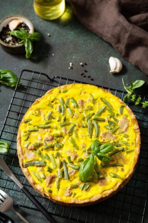 Photo for Classic quiche Lorraine pie with tuna, green beans and soft cheese. Crustless quiche with eggs, fish and vegetables. Mediterranean ketogenic healthy diet. View from above. Copy space. - Royalty Free Image