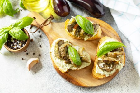 Photo for Open sandwiches set with grill aubergine and cream cheese on a stone table. Healthy food, vegetarian appetizer. - Royalty Free Image