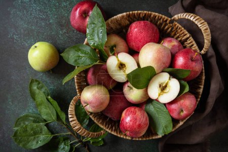 Photo for Fruit background, organic fruits. Still life food. Basket of ripe apples on a stone table. View from above. - Royalty Free Image