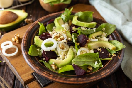 Photo for Vegan food, low calories dieting meal.Couscous with avocado, beet, green beans, spinach on a rustic wooden table. - Royalty Free Image