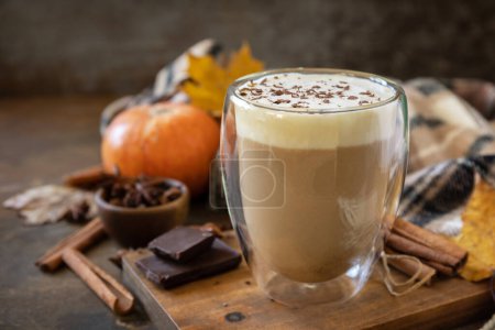Photo for Pumpkin latte spice coffee, warm scarf and maple leaves on rustic background. Seasonal autumn concept with hot drink. Copy space. - Royalty Free Image