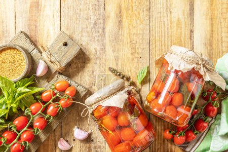 Photo for Healthy homemade fermented food. Salted pickled tomatoes with mustard, preserved canned in glass jar. Home economics, autumn harvest preservation. View from above. Copy space. - Royalty Free Image