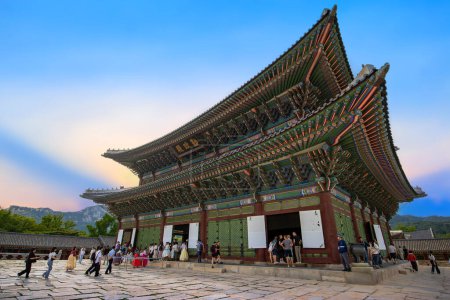 Photo for Gyeongbokgung Palace, Seoul, South Korea : June 17 2023 : Geunjeongjeon Hall in Gyeongbokgung Palace the famous landmark of South Korea before closing time with the traveler in the sunset sky - Royalty Free Image