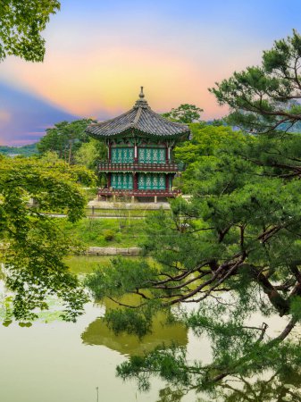 Photo for Sunset at the Hyangwonjeong Pavilion in the center of the pond in the Gyeongbokgung palace, Seoul, South Korea. - Royalty Free Image