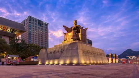 Photo for Seoul, South Korea: August 6, 2023: The statue of King Sejong the Great, situated at Gwanghwamun Square, towers against the beautiful night sky as an important landmark of South Korea. - Royalty Free Image