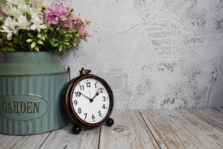 Vintage alarm clock with space copy on concrete wall background