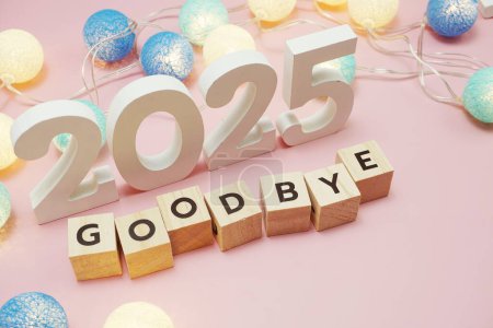 Photo for Goodbye 2025 alphabet letters with space copy on pink background - Royalty Free Image