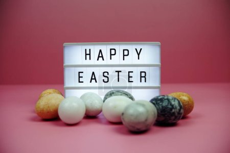 Happy Easter light box with easter element decoration on pink background