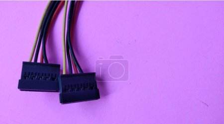 Close up of computer cable isolated on pink background with copy space.