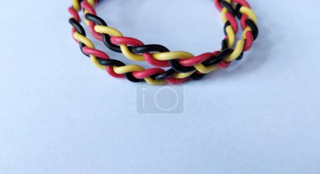 Multicolored electrical cable on a white background close-up.