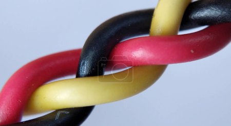 Multicolored electrical cable on a white background close-up.