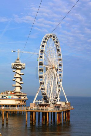 Photo for Scheveningen, The Hague, The Netherlands, 10-30-2022, Ferris wheel and bunjee jumb on the beach of Scheveningen, Holland, The Netherlands. - Royalty Free Image