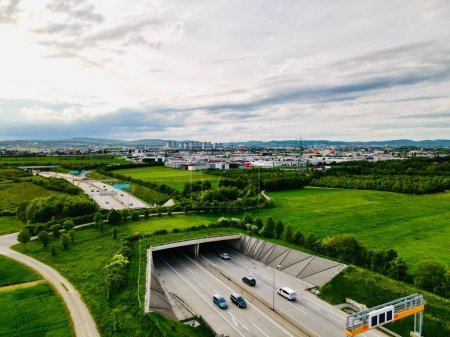 Photo for Vienna Austria May.3 2023, Aerial view of Highway with ecoduct bridge overpass for wild animals and pedestrians - Royalty Free Image