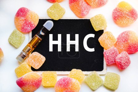 Photo for HHC Hexahydrocannabinol is a psychoactive half synthetic cannabinoid edibles and vape cartridge - Royalty Free Image