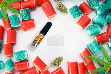 Photo for Synthetic Cannabis products flat lay vape cartridge buds and gummy candies on white - Royalty Free Image