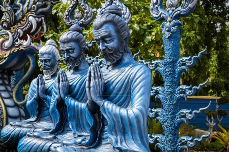 Photo for Wat Rong Suea Ten, better known as The Blue Temple, is located in Chiang Rai, a four-hour drive north of Chiang Mai. The temple statues and walls are decorated in a brilliant blue hue of sapphire. - Royalty Free Image