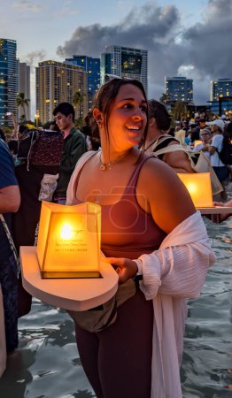 Photo for Hawaii, honolulu - 20230530: Shinnyo Floating Lantern Festival - people carry their personal lantern to the ocean with wishes written for their dear departed dead. - Royalty Free Image