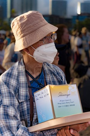 Photo for Hawaii, honolulu - 20230530: Shinnyo Floating Lantern Festival - people carry their personal lantern to the ocean with wishes written for their dear departed dead. - Royalty Free Image