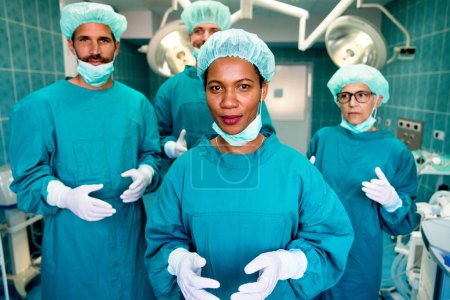 Photo for Group of exhausted surgeons at the emergency room as a sign of stress and overwork in hospital - Royalty Free Image