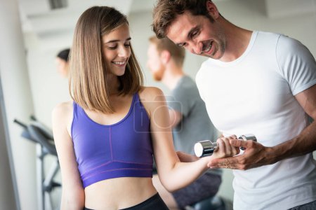 Photo for Portrait of attractive young fit woman in gym - Royalty Free Image