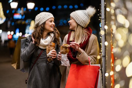Photo for Portrait of cheerful young happy women doing Christmas shopping. Christmas sale people concept - Royalty Free Image