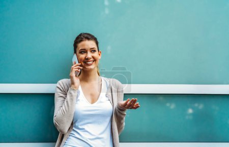 Photo for Beautiful young business, student woman using mobile phone outdoors. People communication technology concept. - Royalty Free Image