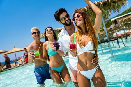 Photo for Group of friends together enjoying party, cocktails on summer vacation. People travel happiness fun concept. - Royalty Free Image