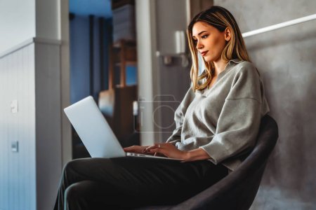 Photo for Young success woman freelancer is working on a new project on laptop. Technology work business people concept. - Royalty Free Image