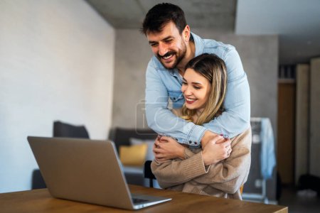 Photo for Young happy couple having video call online, conversation with relatives, communicating with friends. Happy people technology concept. - Royalty Free Image