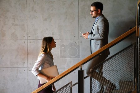 Photo for Young coworker business people climb the stairs in the office building - Royalty Free Image