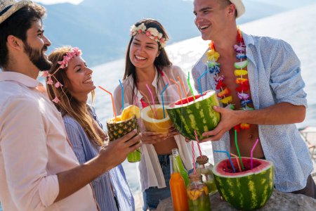 Photo for Group of multiethnic friends enjoying Hawaiian party on summer vacation. Summertime vibes, travel concept. - Royalty Free Image